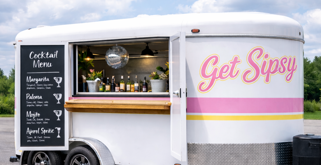 Get Sipsy pink mobile bar trailer at an outdoor party
